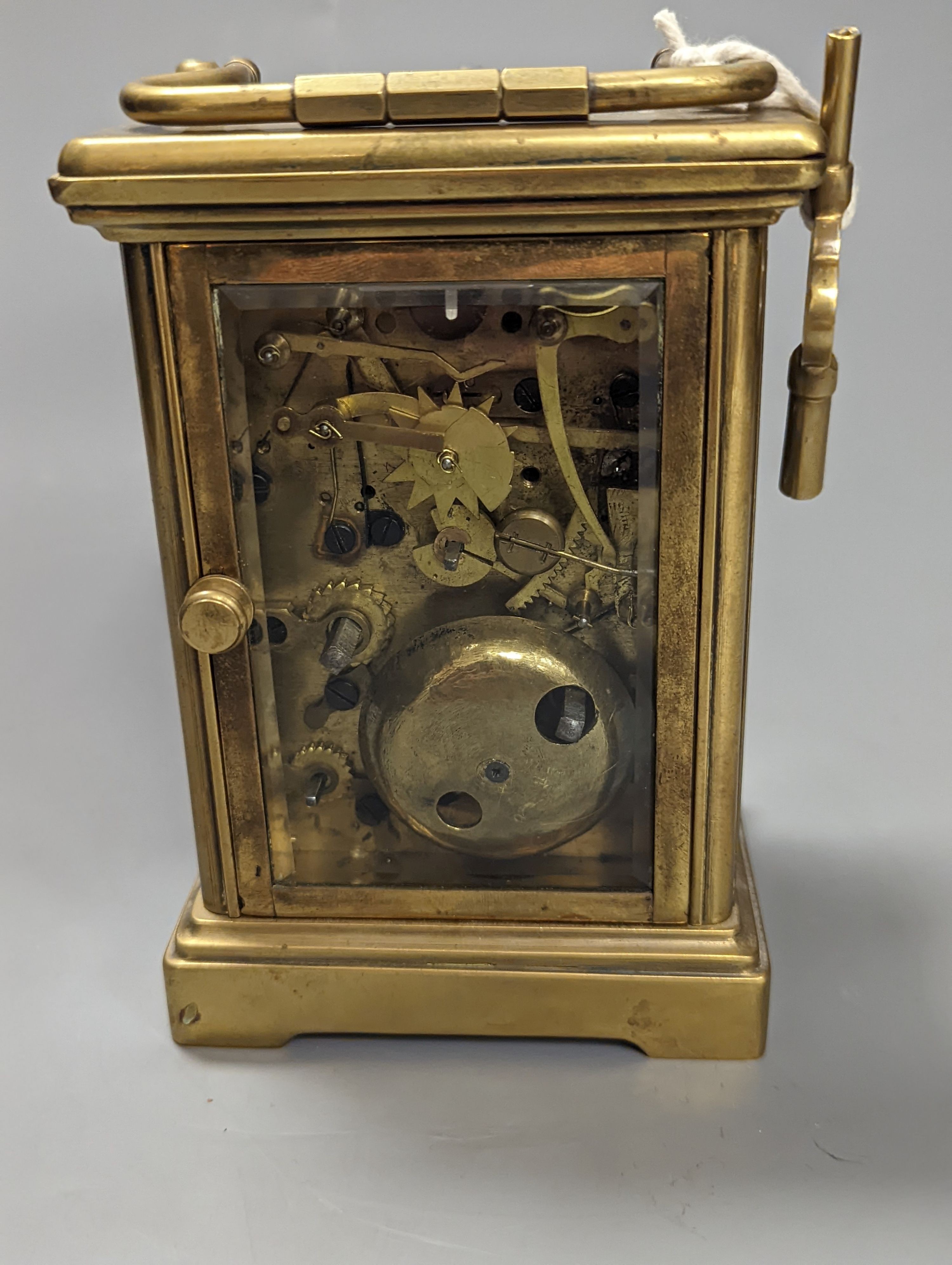 A brass cased carriage clock, with key. 16cm